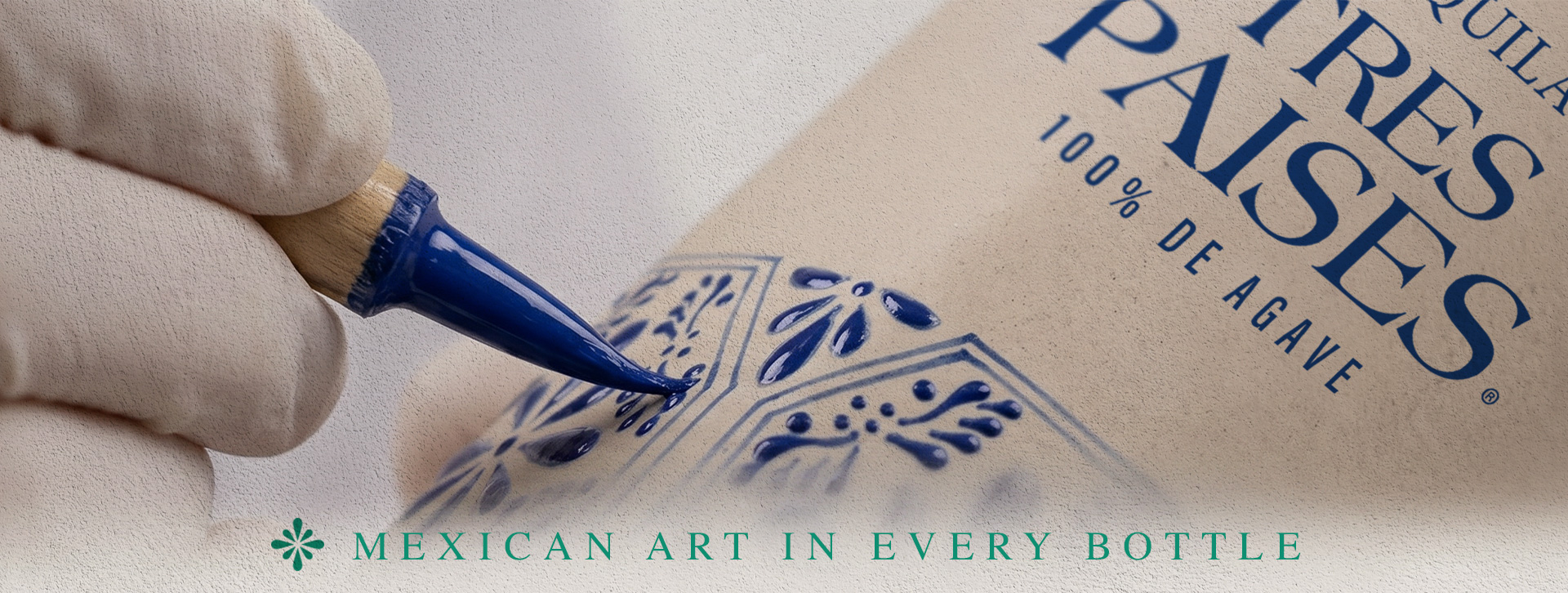 Hand-painting a Tres Países bottle